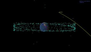 A depiction showing how close Apophis will pass to Earth on Apr. 13, 2029, compared to the International Space Station (in purple) and other satellites (in blue).