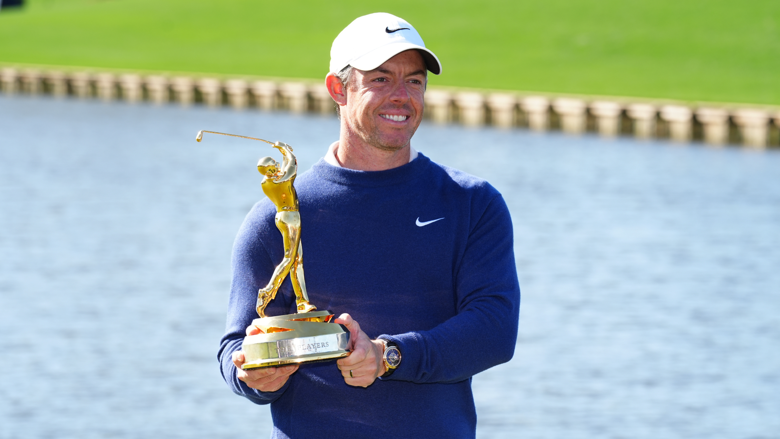 Rory McIlroy poses for a photo with The Players Championship trophy