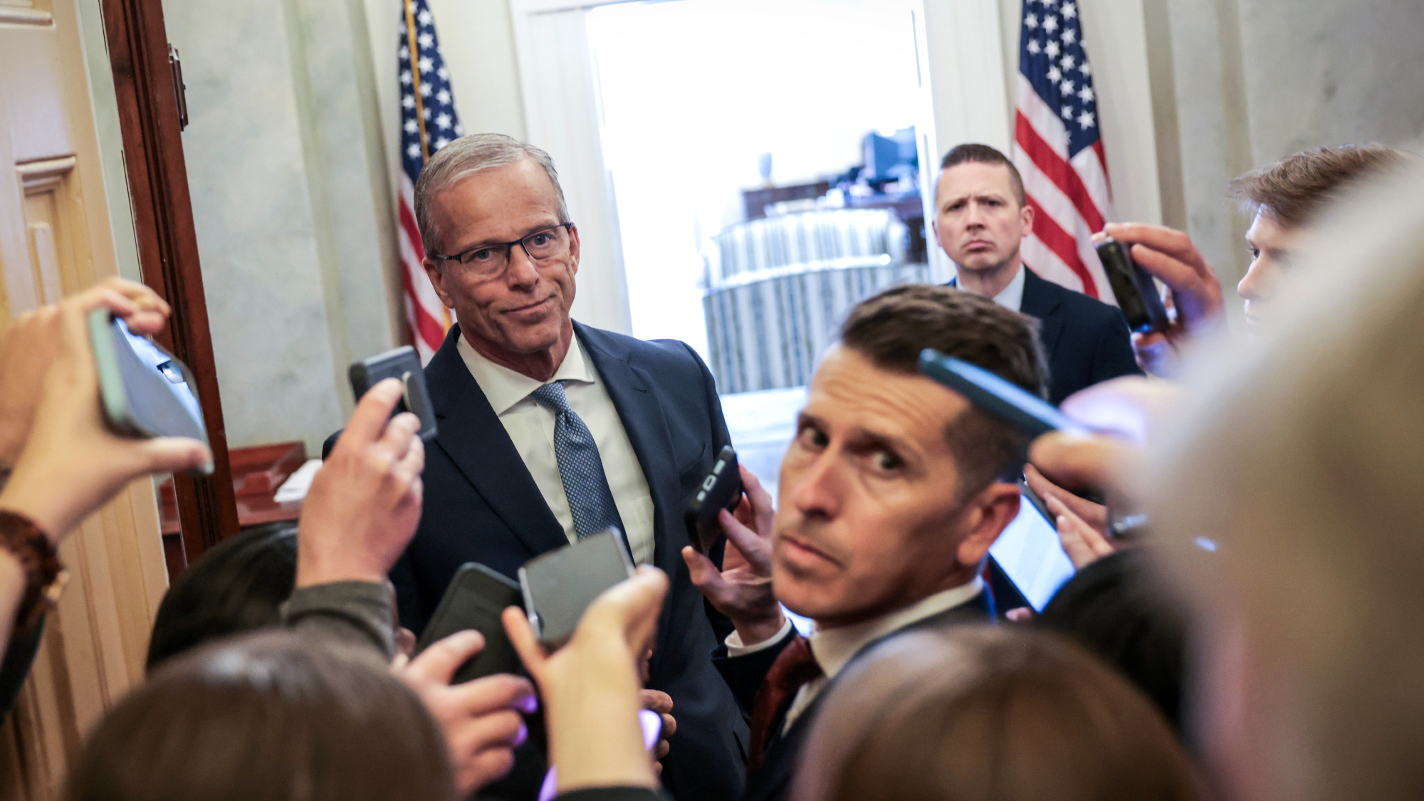 Senate Majority Leader John Thune (R-S.D.) talks to reporters after pausing ICE funding bill