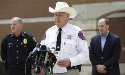 Kaufman County Sheriff David Byrnes speaks at a news conference on March 30, after the McLellands were found dead in their home.