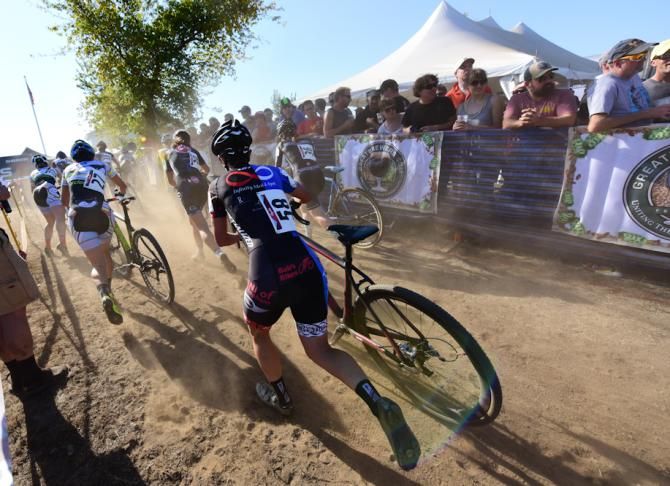 The Elite Women run past the beer garden on lap one