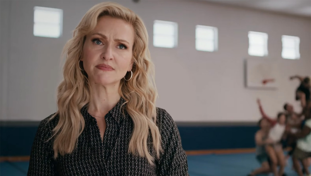 Jenn Lyon looks perplexed as the Buttons fall in pyramid formation in the Stumble pilot.