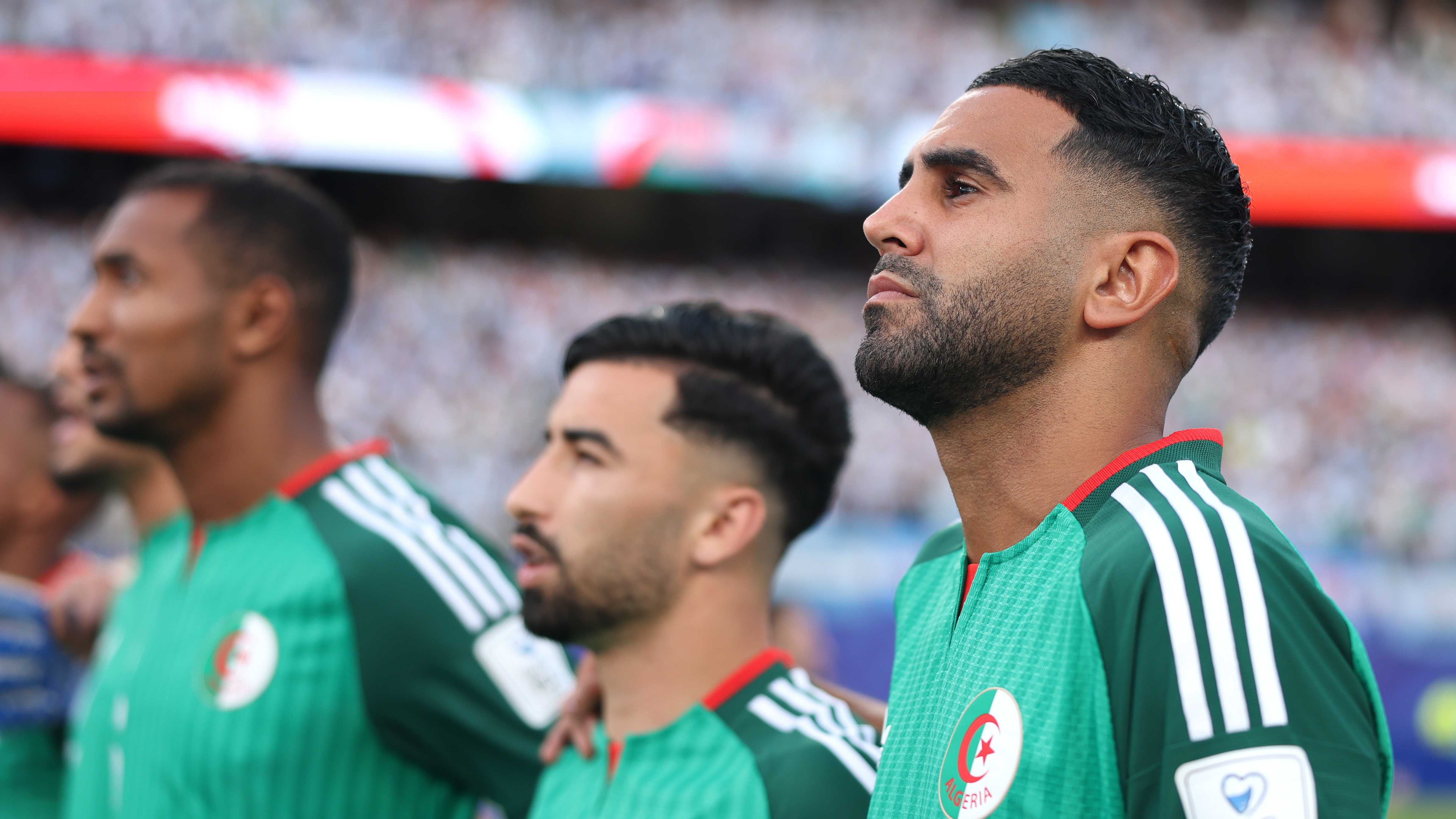 Riyad Mahrez #7 of Algeria stands for the national anthem before the FIFA World Cup 2026 Group J match between Argentina and Algeria