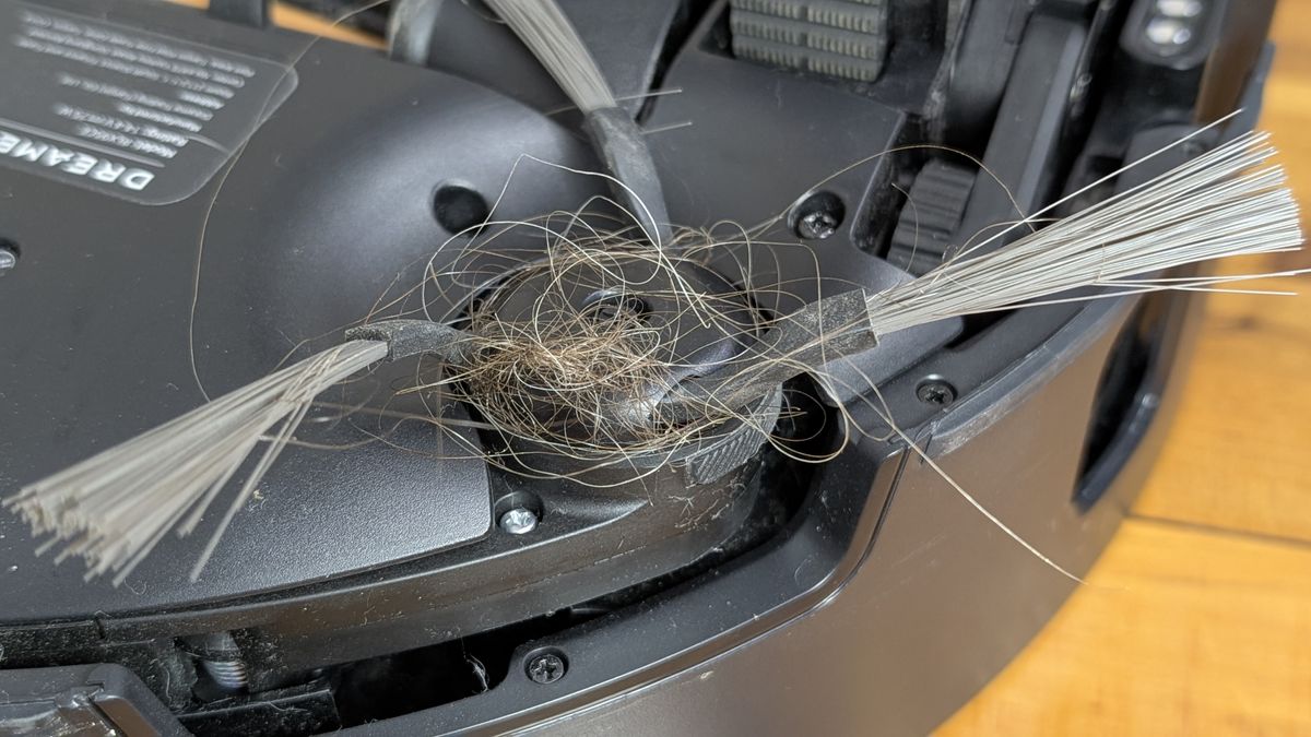 Dreame Matrix10 Ultra robovac close up of side brush with hair wrapped around it