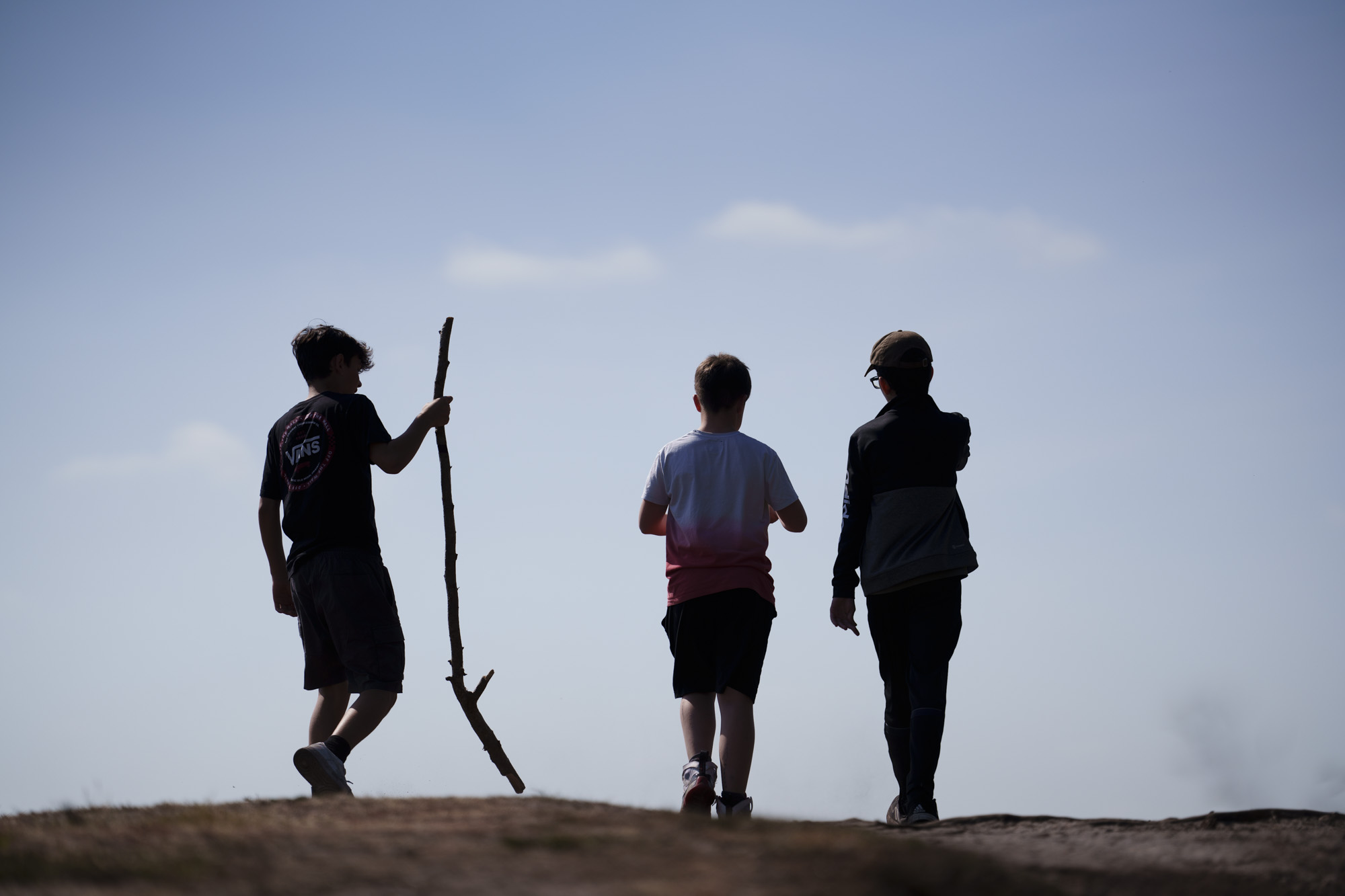 Sihouette of three people on horizon, taken with the Sony FE 50-150mm F2 GM lens