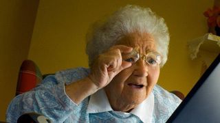 Meme image of old woman looking confused while looking at a computer
