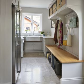 Utility room with light grey shaker cabinets and a built-in boot room.