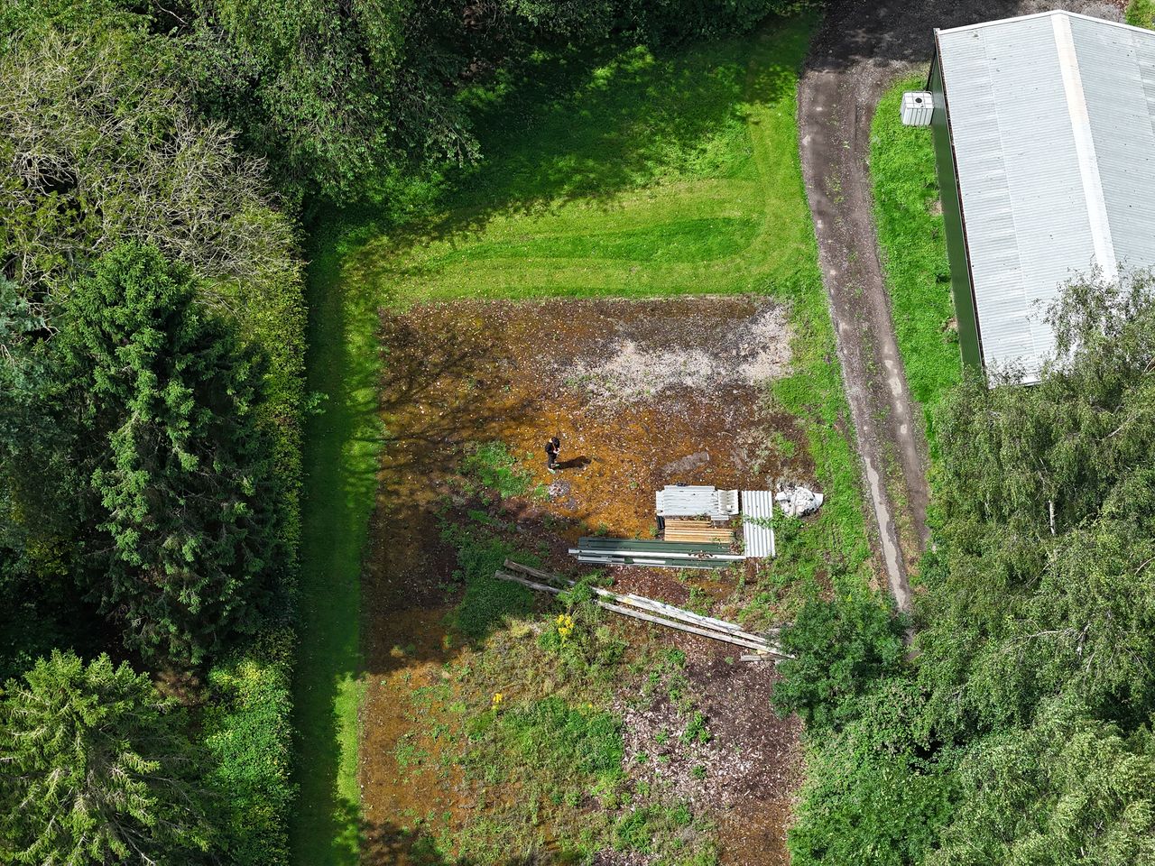 DJI Air 3 aerial photo of rural farmland on a sunny day with the 70mm telephoto camera