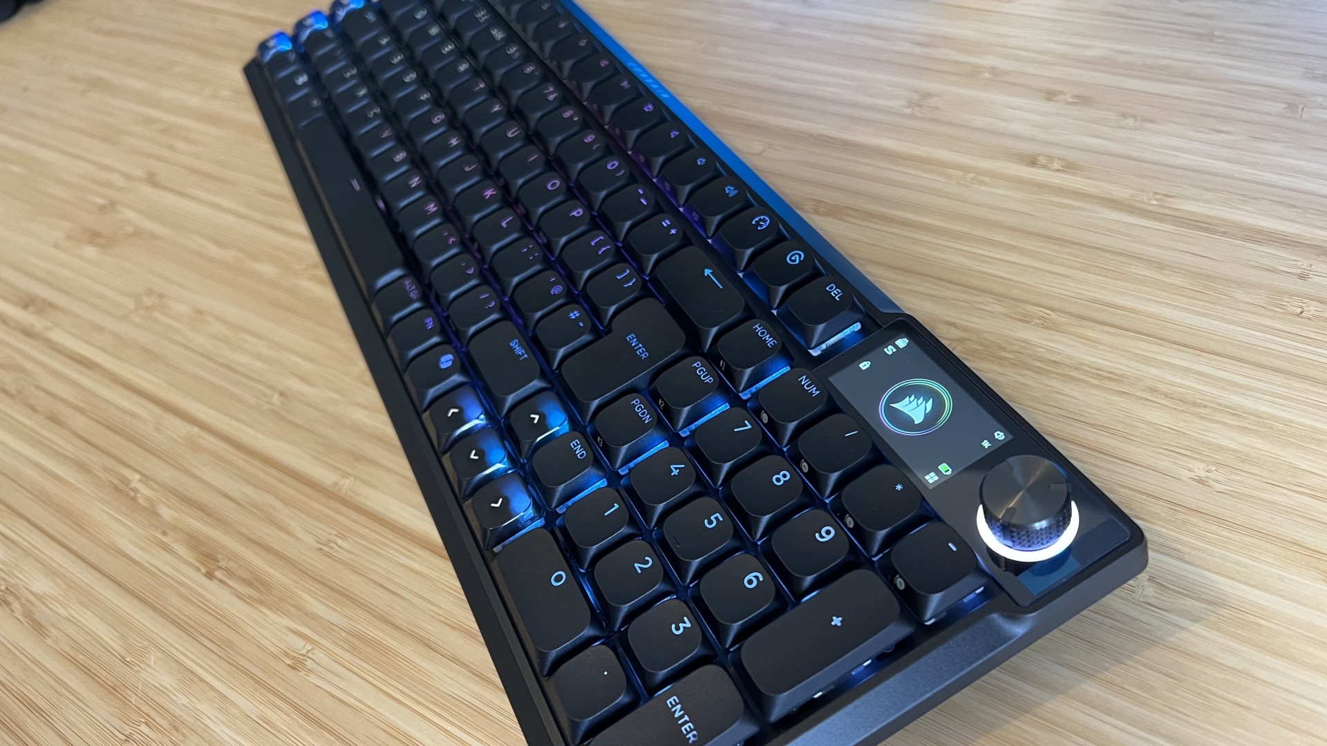Corsair Vanguard Air 99 Wireless gaming keyboard photographed from the number pad on a wooden desk