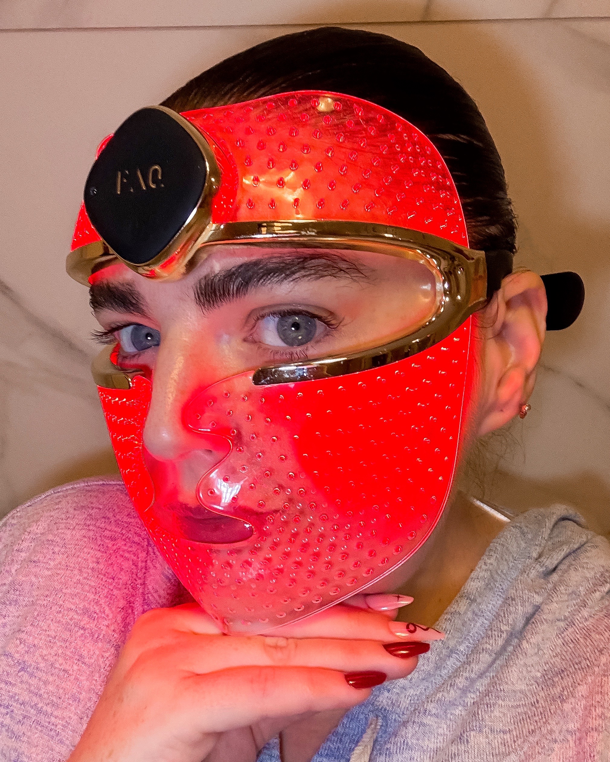 Laura Pearson with LED mask on