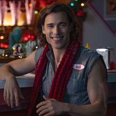 Dustin Milligan as Jack, sitting at a diner counter, in 'Hot Frosty.'