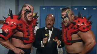 Legion Of Doom rocks their shoulder pads during an interview with Mean Gene.