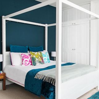 master bedroom with modern four poster bed