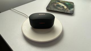 Sony WF-1000XM4 on wireless charging pad