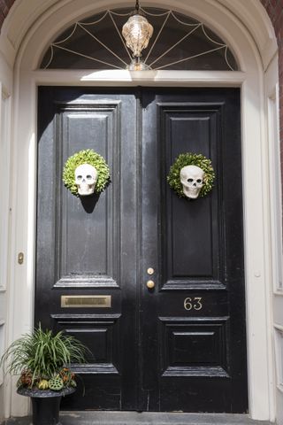 A front door decorated for Halloween