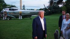 President Donald Trump talks to reporters