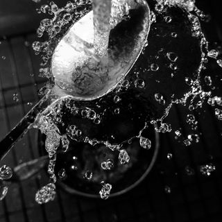 Spoon under a tap as part of Larry Fink's quarantine photography series created during Covid-19