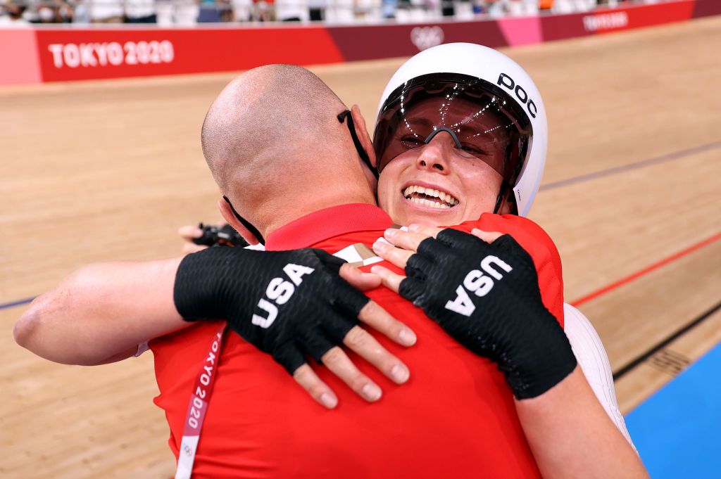 IZU JAPAN AUGUST 08 Jennifer Valente of Team United States is congratulated from her coach after winning the gold medal during the Womens Omnium points race 4 round of 4 of the track cycling on day sixteen of the Tokyo 2020 Olympic Games at Izu Velodrome on August 08 2021 in Izu Shizuoka Japan Photo by Justin SetterfieldGetty Images