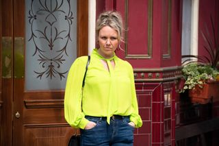 EastEnders Janine Butcher in a yellow blouse