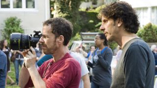 Ethan Coen shooting Burn After Reading with camera while Joel Coen watches