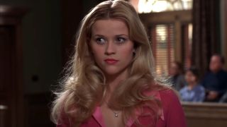 Reese Witherspoon stands in court with a look of revelation in Legally Blonde.