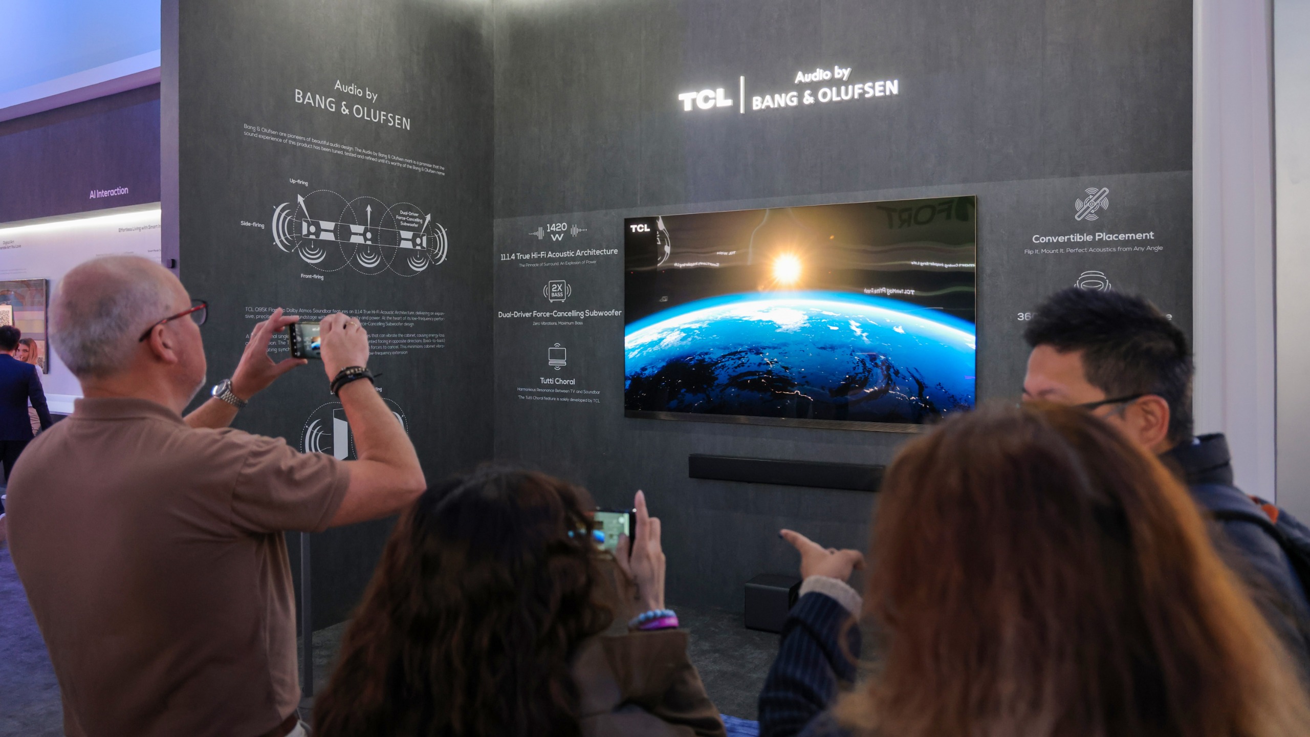 TCL's booth at IFA 2026 where people take photos of a TCL TV on a wall