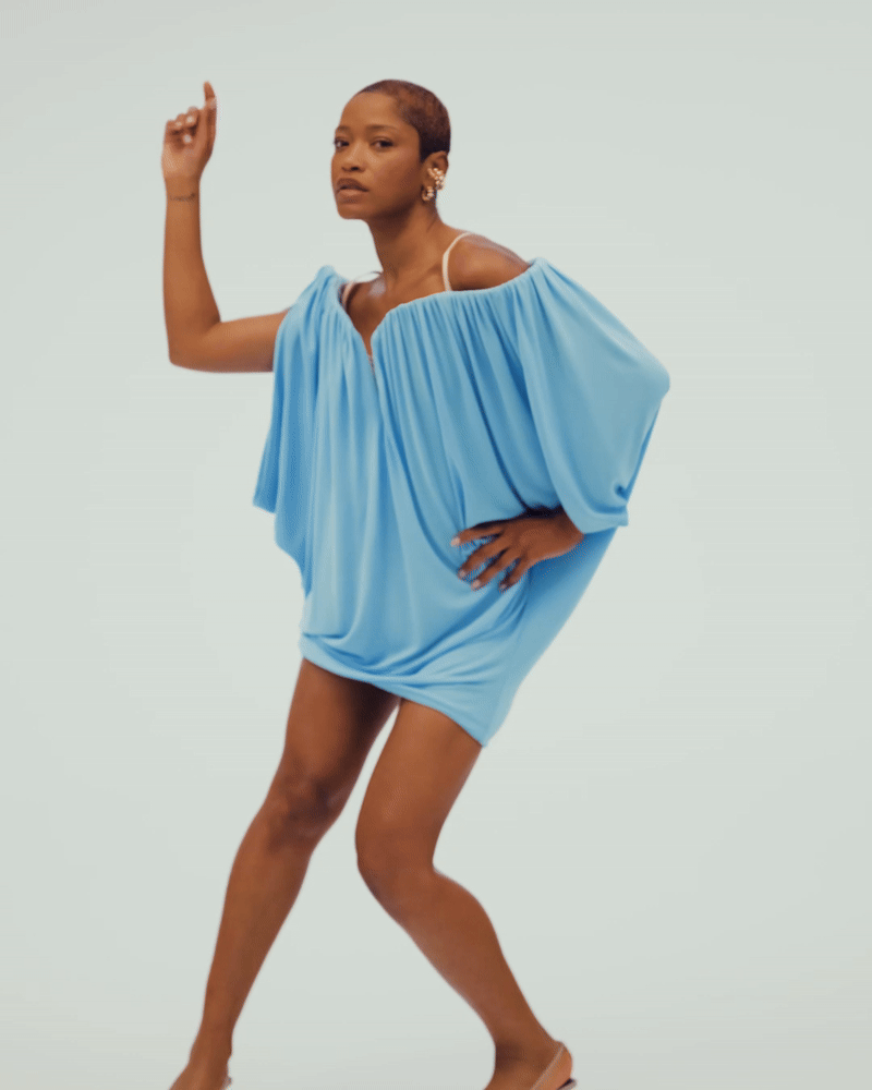 gif of Keke Palmer posing for the camera wearing a flowy blue dress
