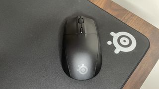 SteelSeries Rival 3 Gen 2 Wireless gaming mouse on a SteelSeries mouse pad on a desk