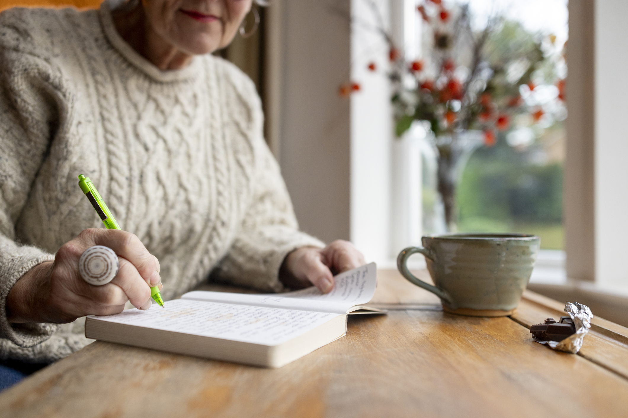 Woman Writing Thoughts in a Diary