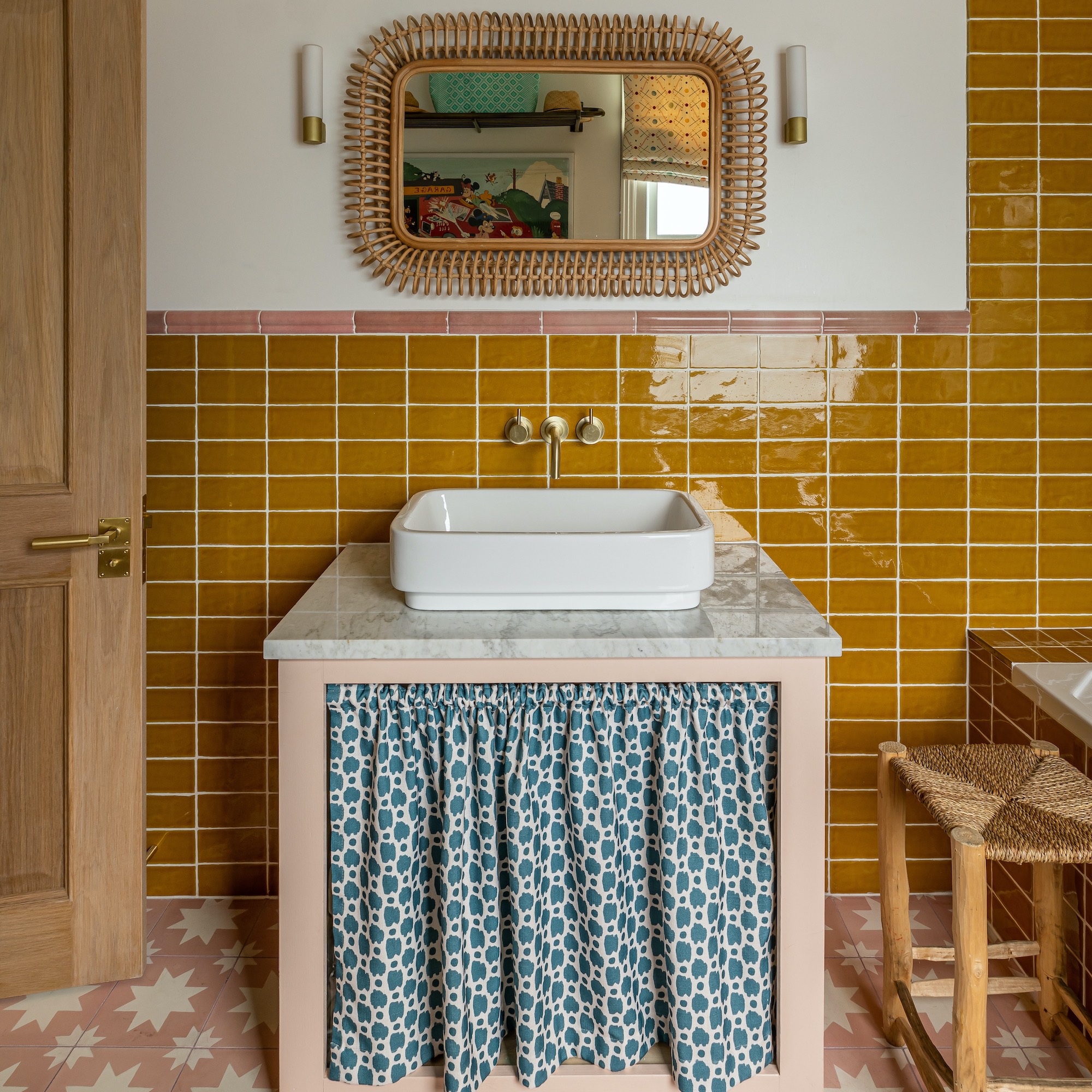 sink unit with curtain and mustard tiles