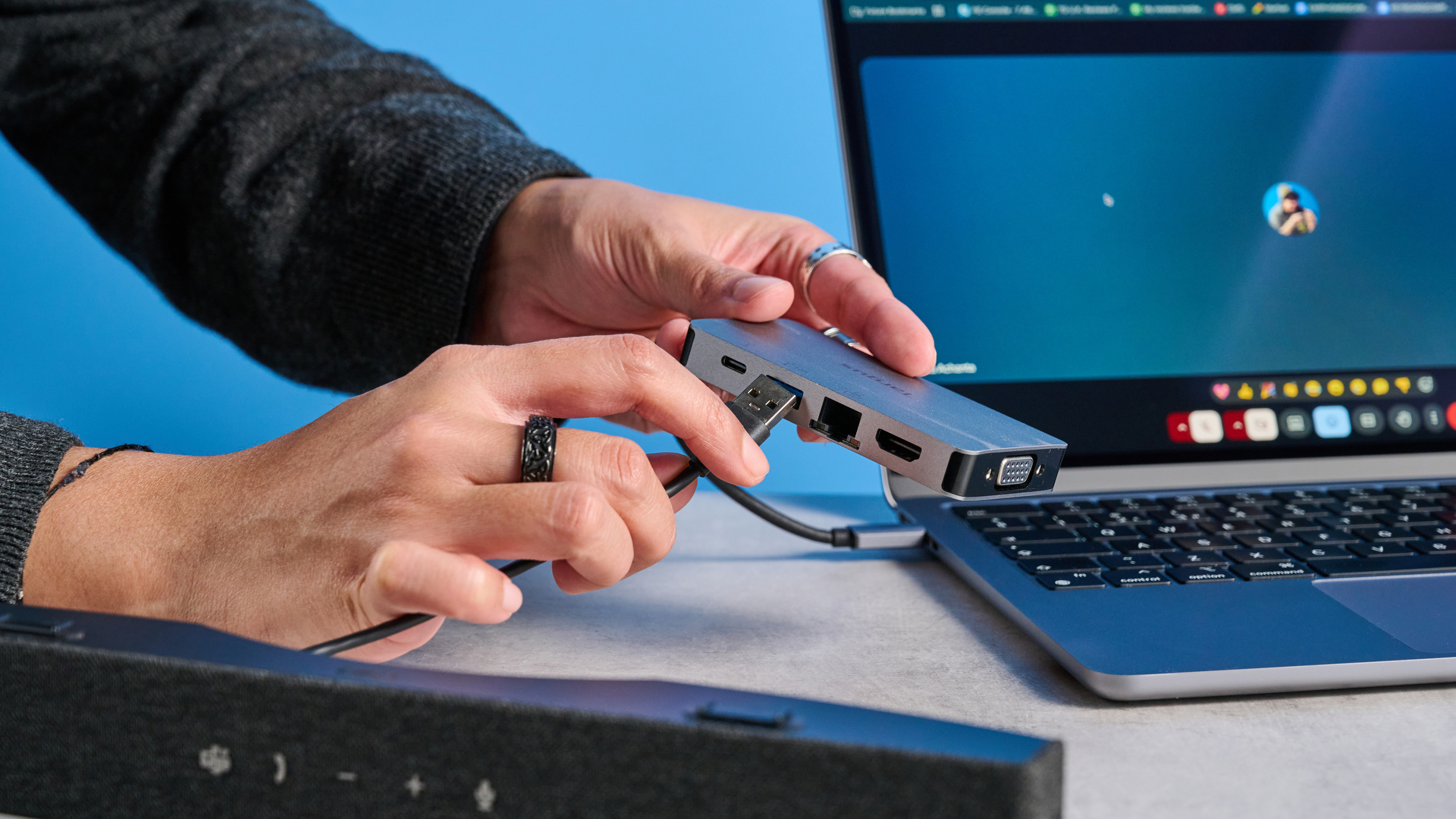 Dell SB725 computing conference soundbar photographed on a blue background