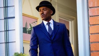 The 15th Doctor wearing a blue pinstripe suit and bowler hat in Doctor Who season 2 episode 7