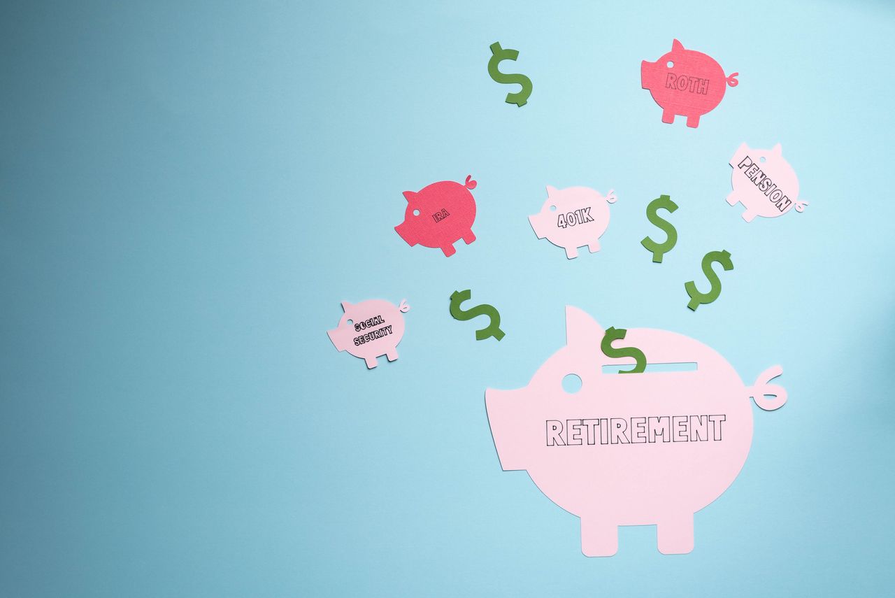 Retirement savings planning concept, IRA, 401K, pension, Roth social security. Piggy bank on blue background