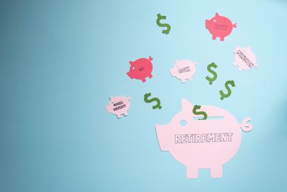 Retirement savings planning concept, IRA, 401K, pension, Roth social security. Piggy bank on blue background