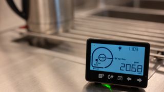 smart energy meter next to a kettle in a kitchen