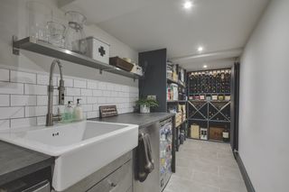small cellar converted into a wine store and utility