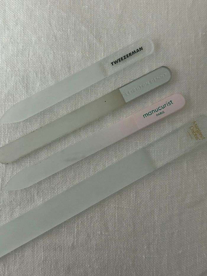 A picture of some of the best nail files on a white linen background, tested by junior beauty editor Grace Lindsay