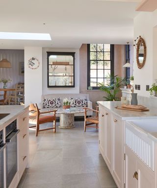 pink kitchen with multiple seating and living areas