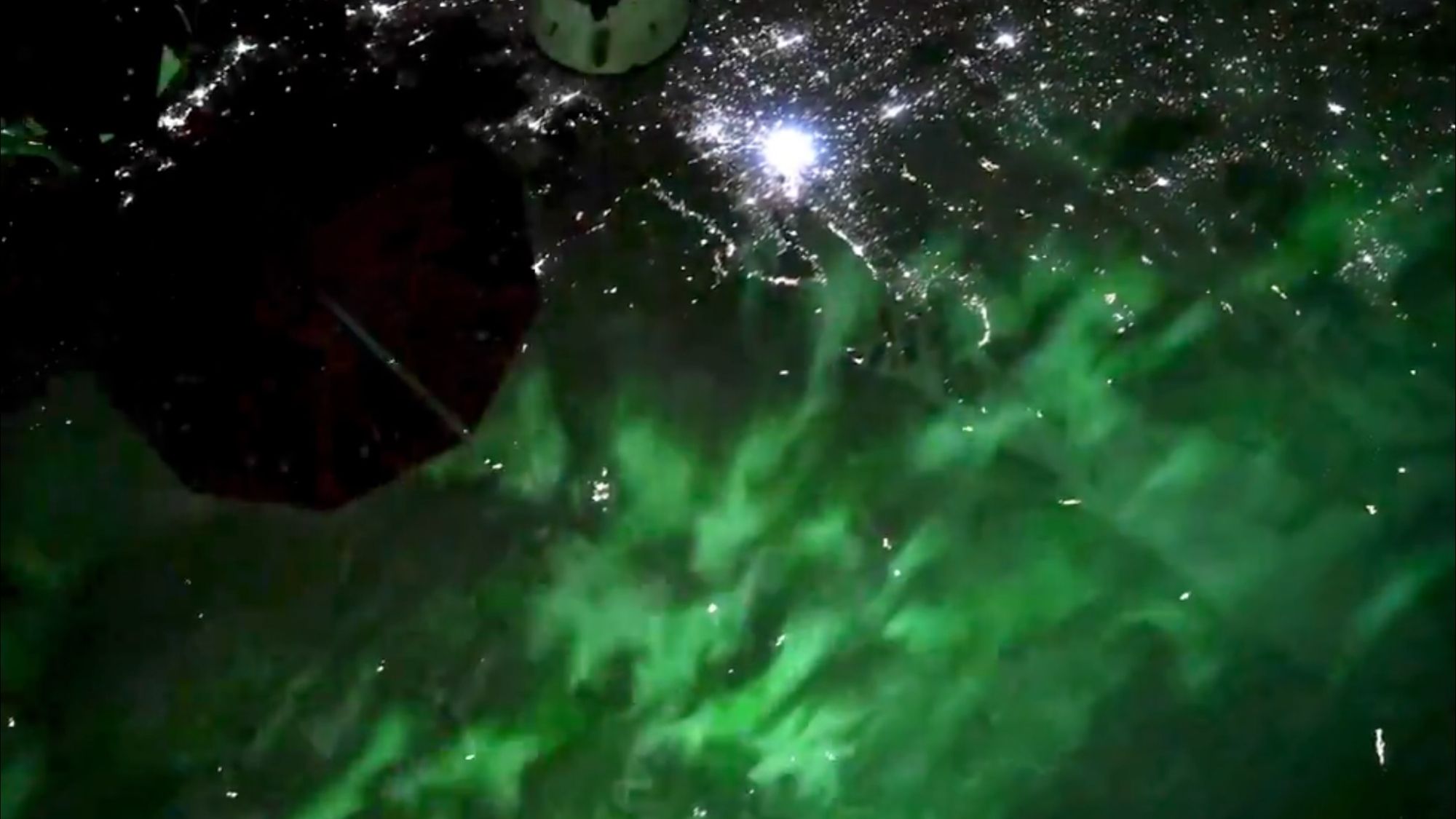 Anil Menon Captures Vivid Green Aurora from Orbit