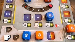 A close up look at the board, dice, and tokens of Sky Team