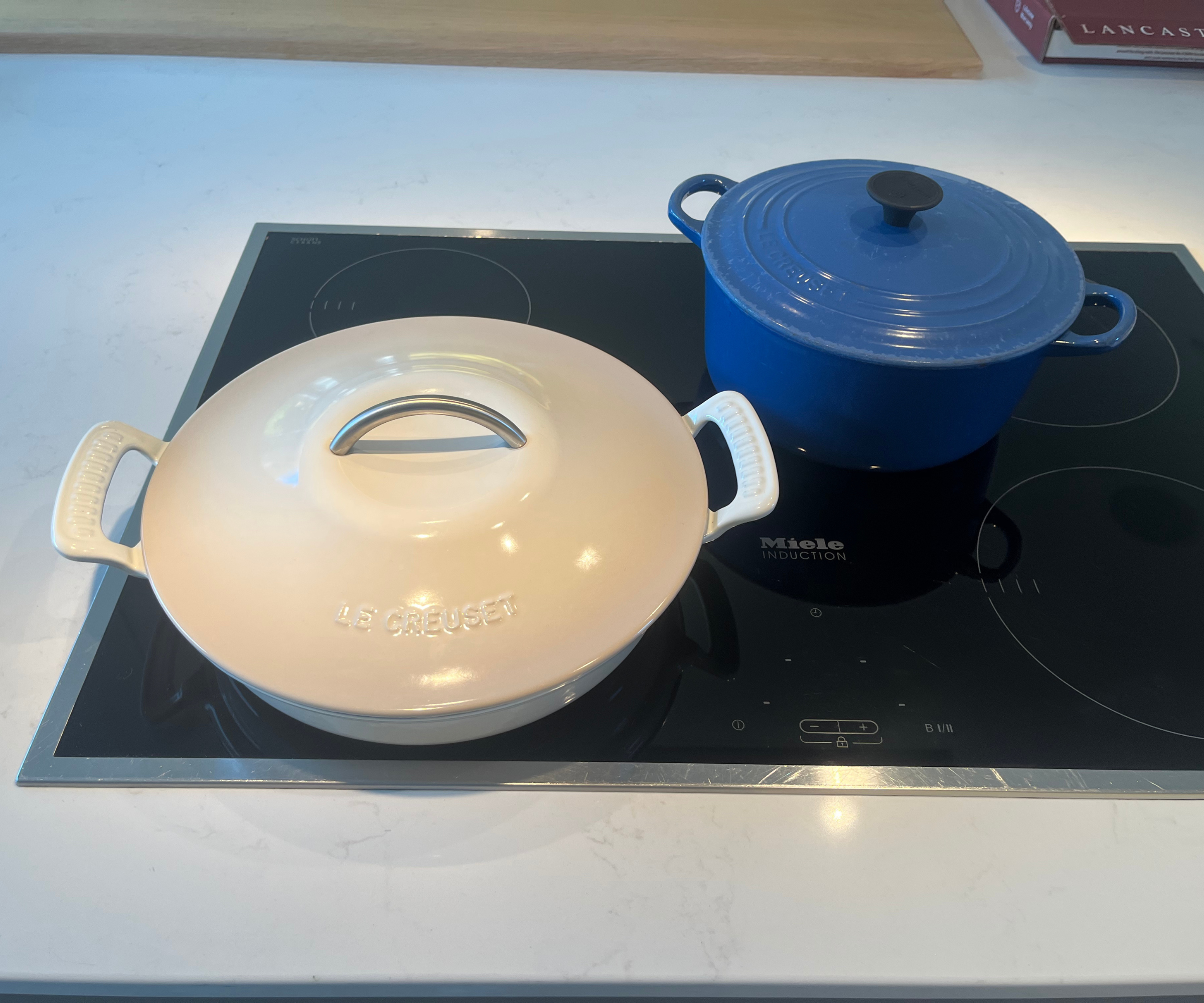Comparing the Le Creuset Modern Heritage Round Braiser (left) to the original Signature Dutch Oven (right)