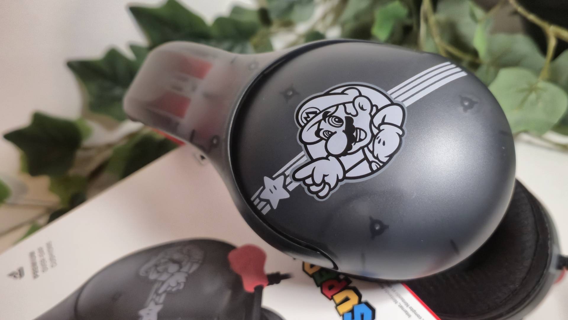 Close up of the Mario Star Turtle Beach Airlite Fit wired headset.