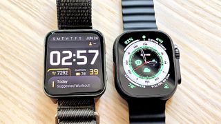 Close up of the Garmin Venu X1 smartwatch next to the Apple Watch Ultra 2