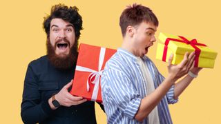 Two men holding gifts in shock