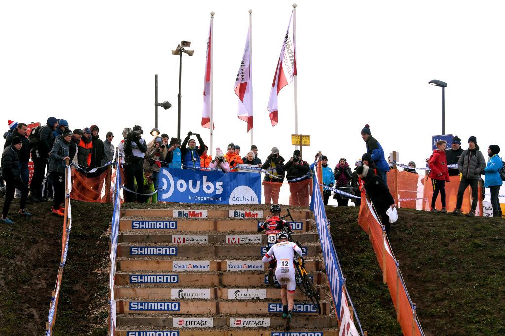 The leading duo charge up the stairs