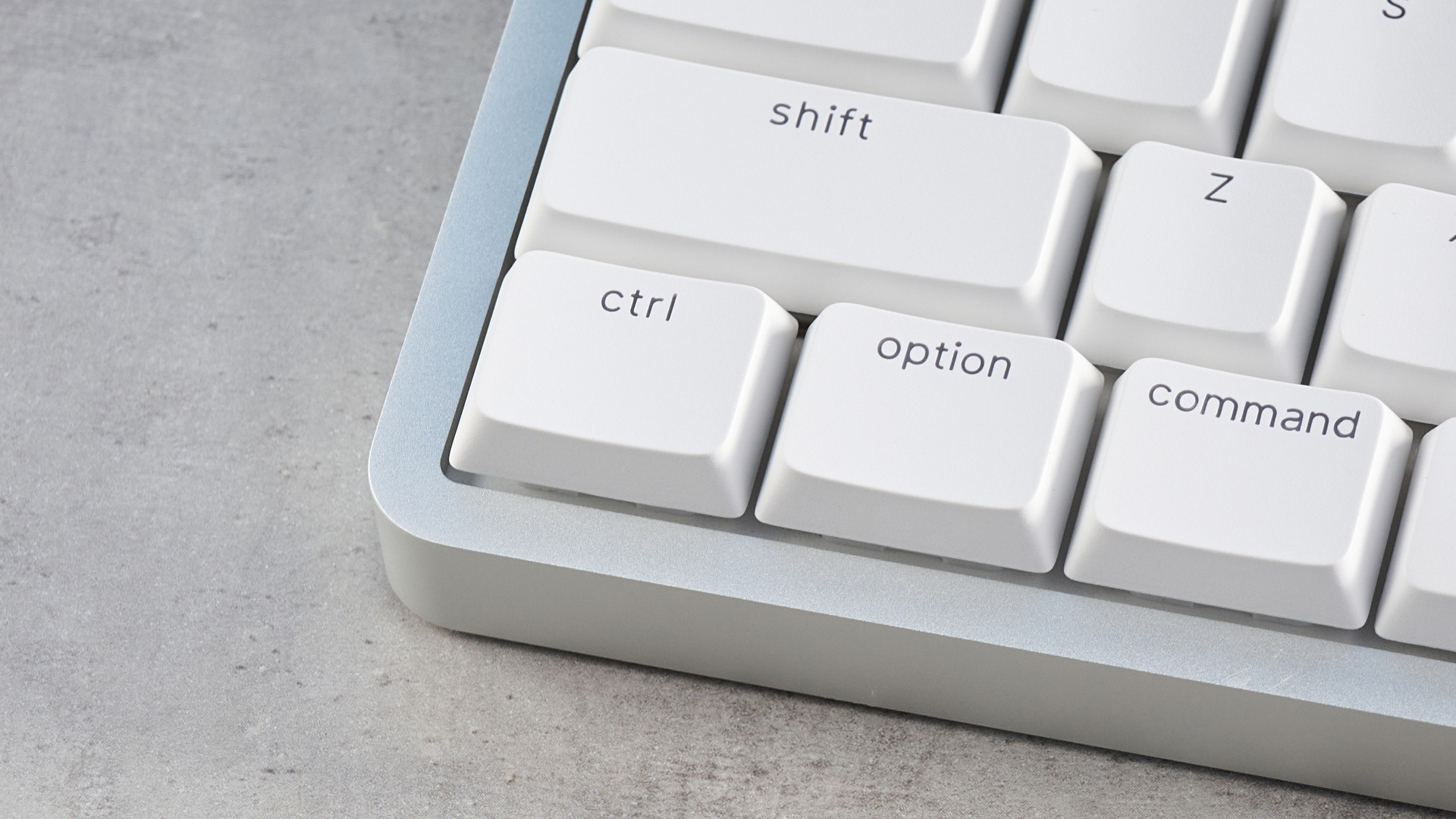 The Lofree Flow 2 on a stone surface with a blue background