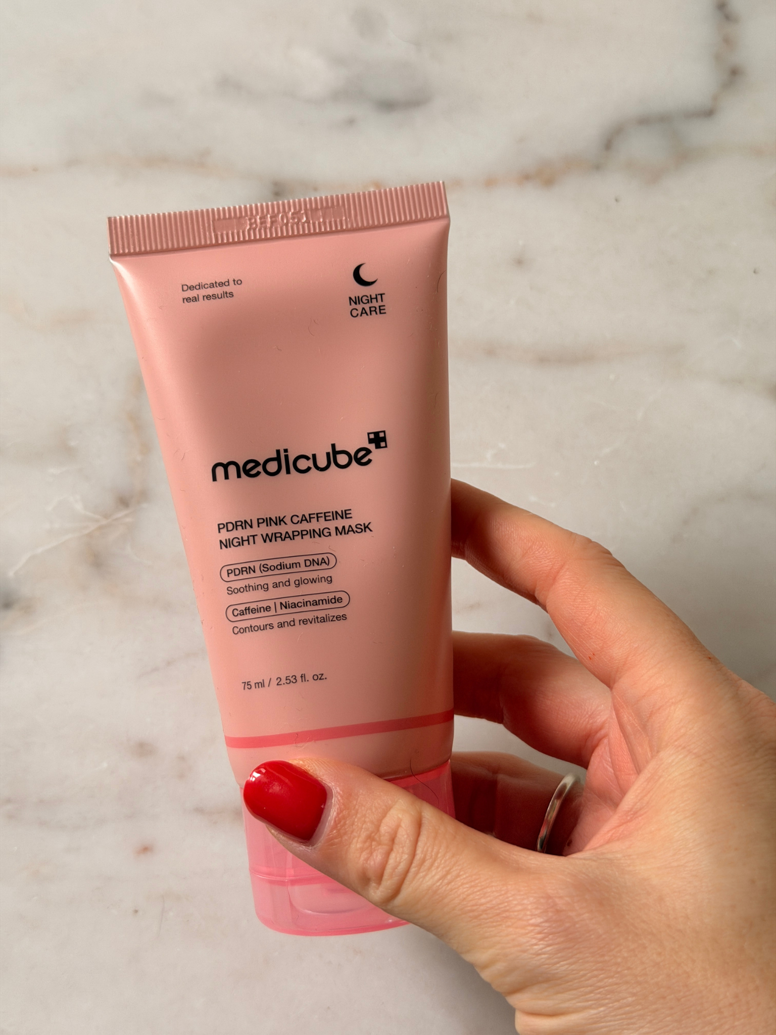 Freelance beauty editor Grace Day holding the Medicube face mask