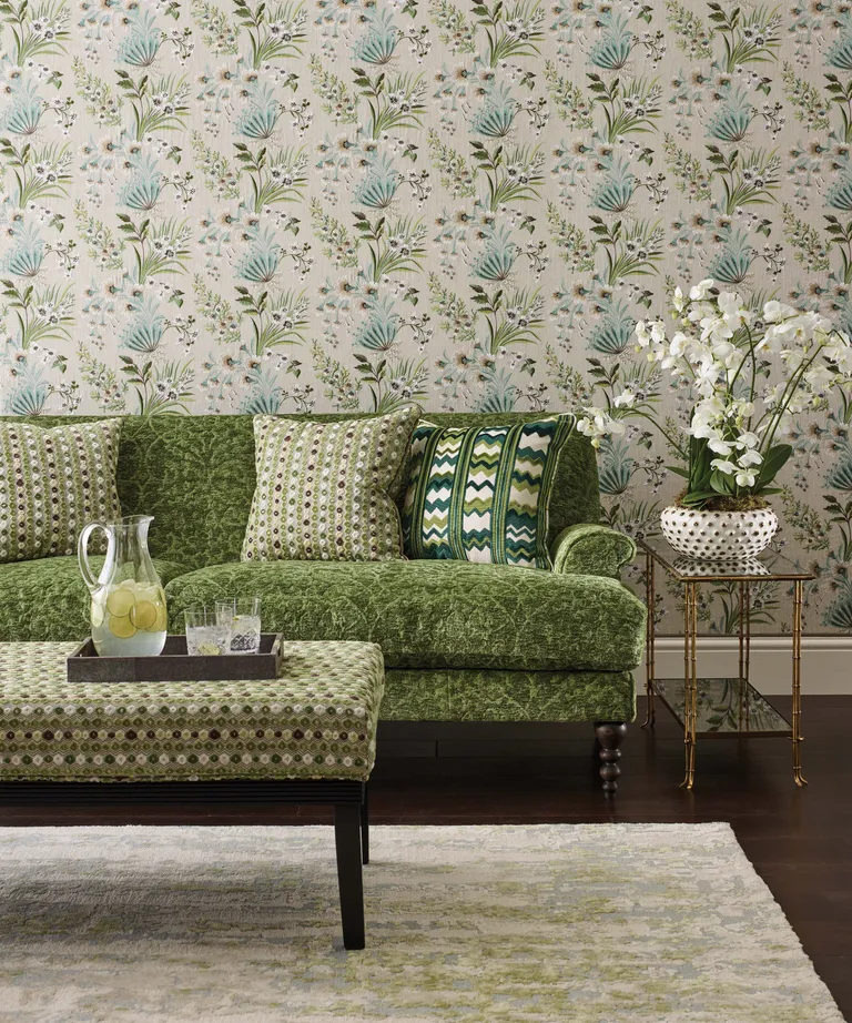 Nina Campbell's green home decor tips, green wallpaper and chair in living room