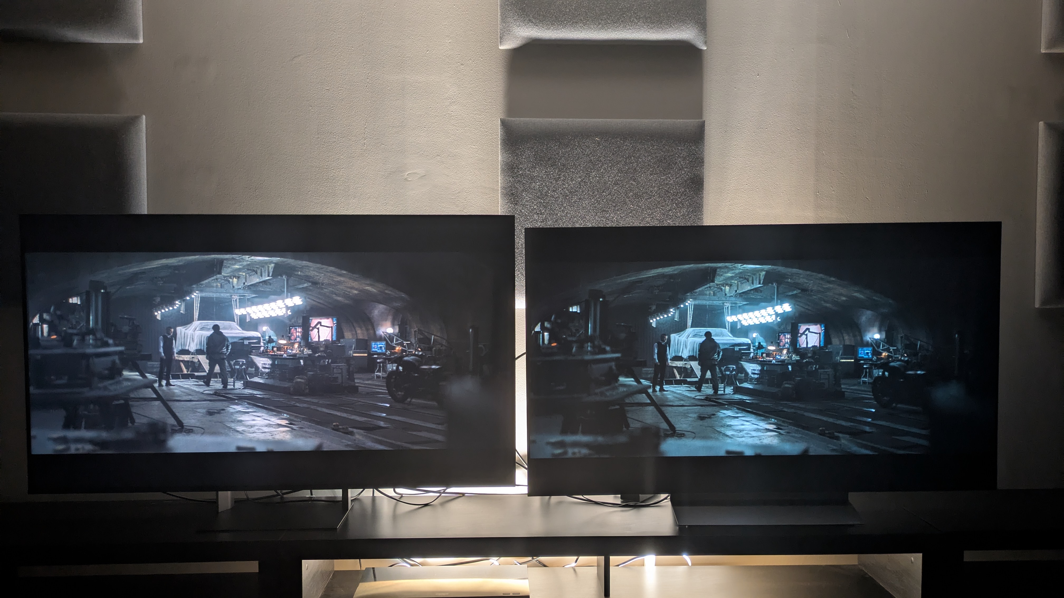 Sony Bravia 7 II (left) vs LG C6 (right) showing shot of Bruce and alfred in the batcave from the batman. Both TVs again have strong contrast, and the Bravia 7 II has a more accurate color profile
