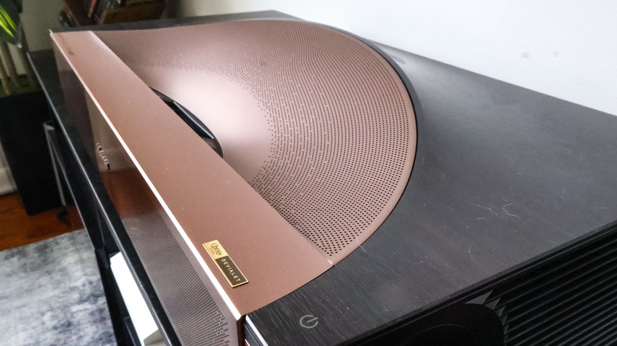 The Hisense L9Q UST projector in a living room